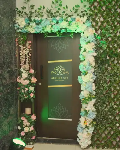 The flower-framed entrance of Adhira Spa on the 2nd floor