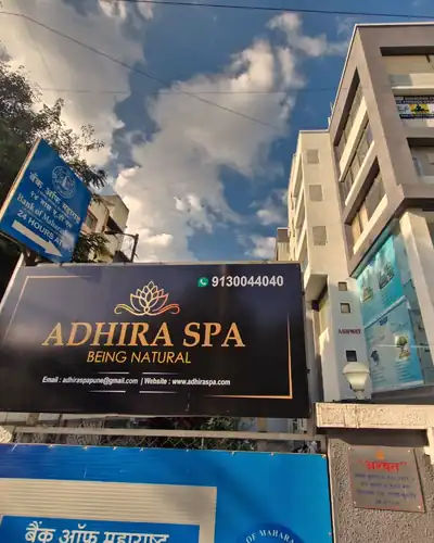 Adhira Spa signboard above Bank of Maharashtra by day